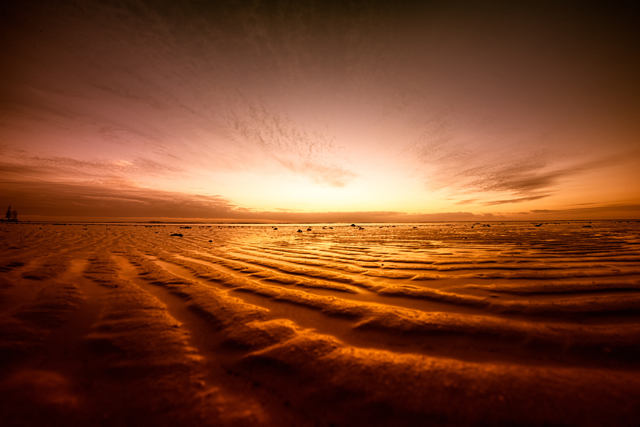 Solnedgang i Vedehavet nasjonalpark som strekker seg fra Ho Bugt til Tysklands grense - Foto: Getty Images